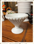 Vintage Westmoreland Swirl and Ball milk glass compote candy dish on wood surface