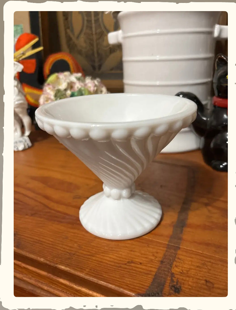 Vintage Westmoreland Swirl and Ball milk glass compote candy dish on wood surface