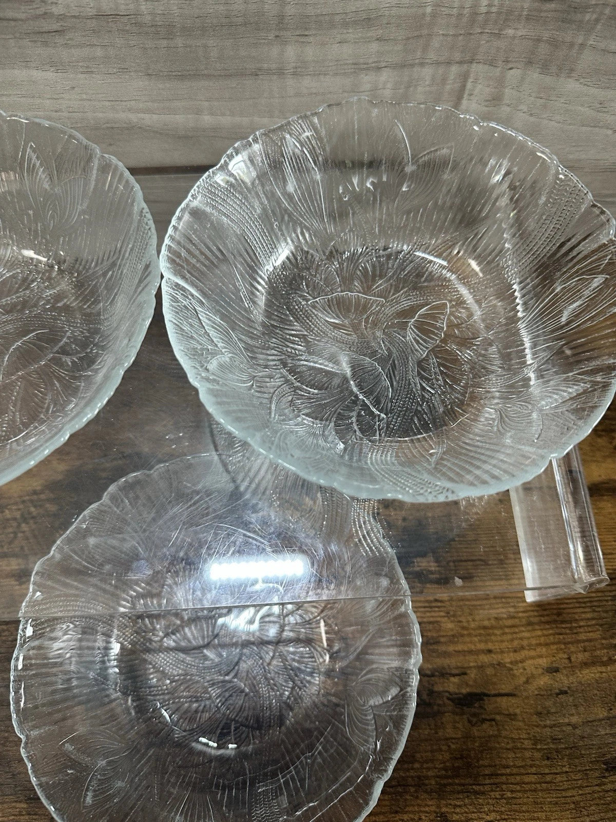 Vintage Arcoroc France Canterbury Crocus pattern clear glass bowls with embossed floral design on wood surface